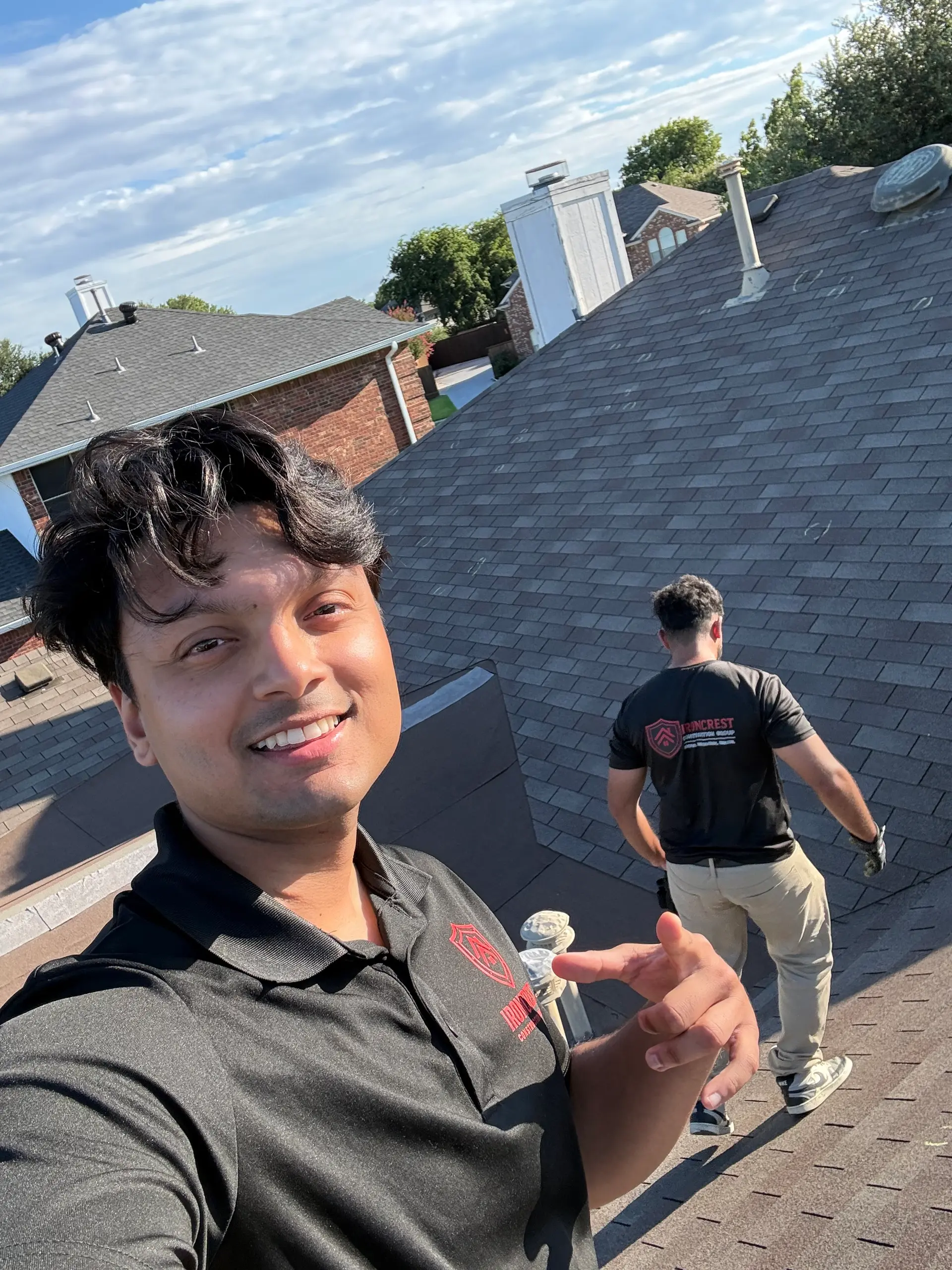 IronCrest Construction Group team performing a rooftop inspection in Plano, TX